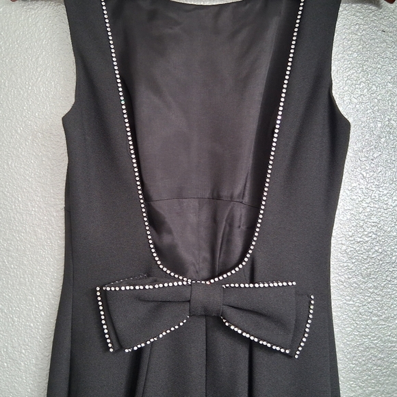 Cach`e Black Jumpsuit With A Scoop Back Outlined With RhinestonesSize 6